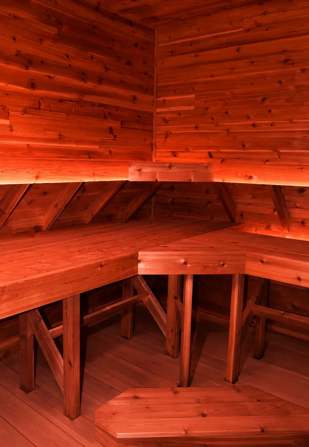 Cedar sauna interior glowing warm red